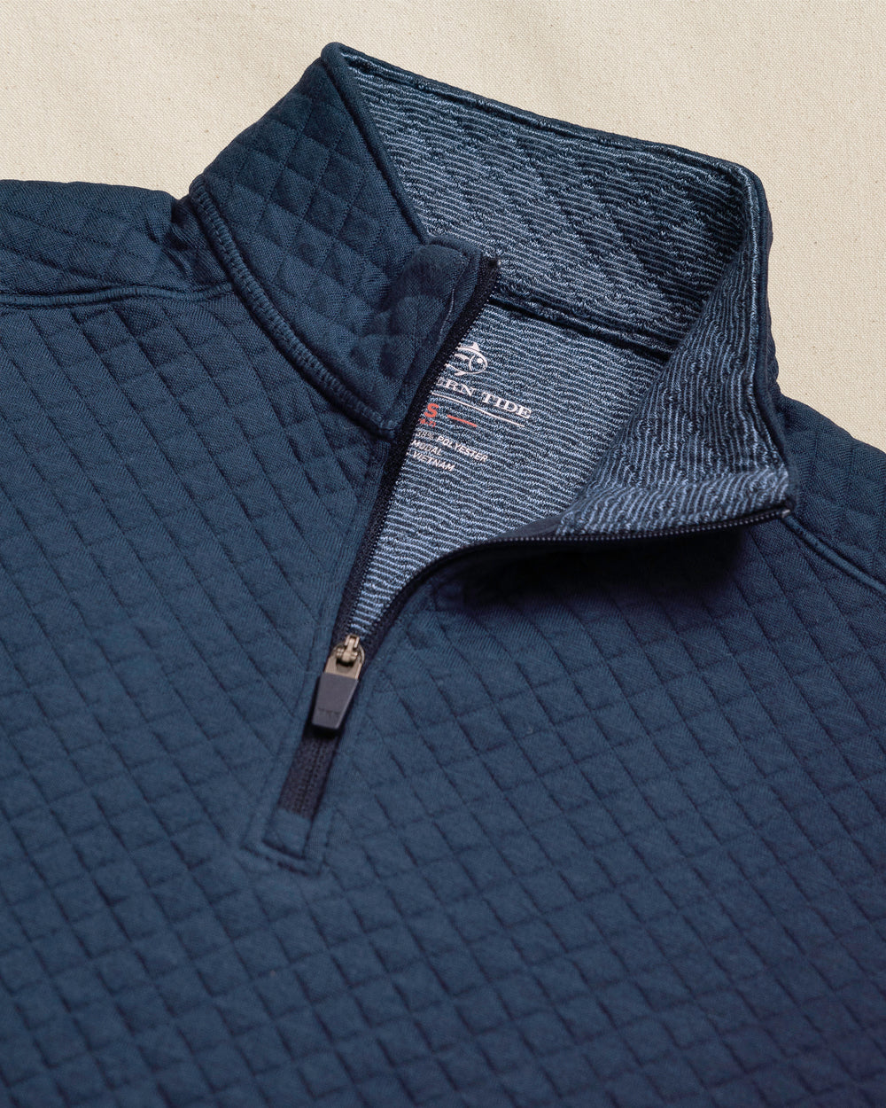 The detail view of the Southern Tide Boys Oak Island Quarter Zip by Southern Tide - Dress Blue