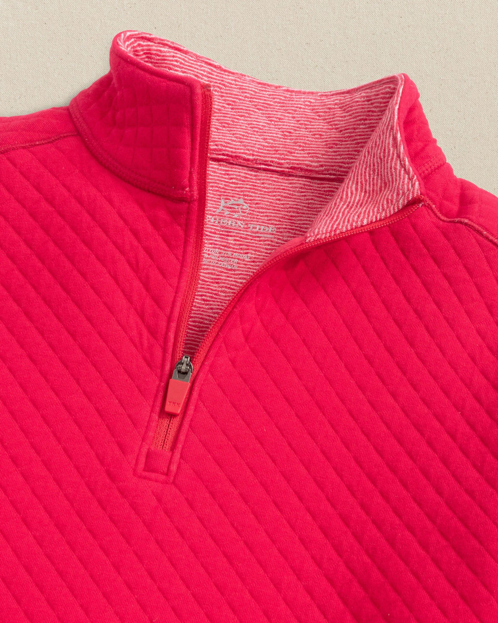 The detail view of the Southern Tide Boys Oak Island Quarter Zip by Southern Tide - Grenadine Red
