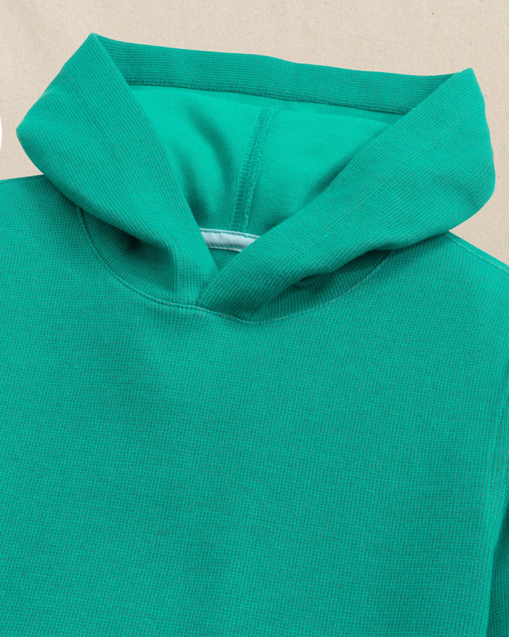 The detail view of the Southern Tide Boys Pearl Cove Fleece Hoodie by Southern Tide - Spruce Shade