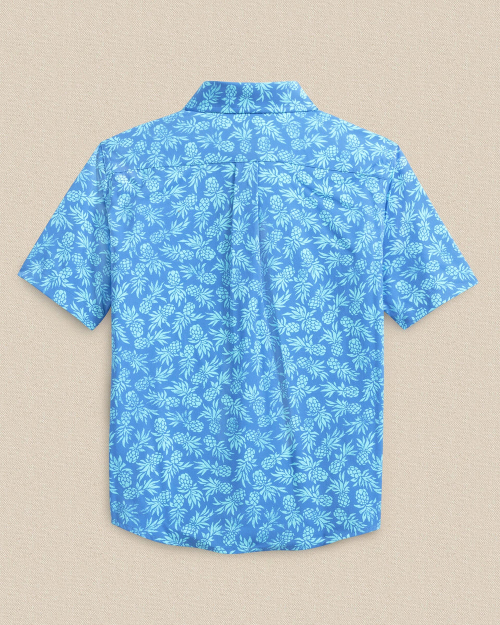 The back view of the Southern Tide Boys Pineapple Parade Coastal Breeze® Short Sleeve Sport Shirt by Southern Tide - Blue Stream