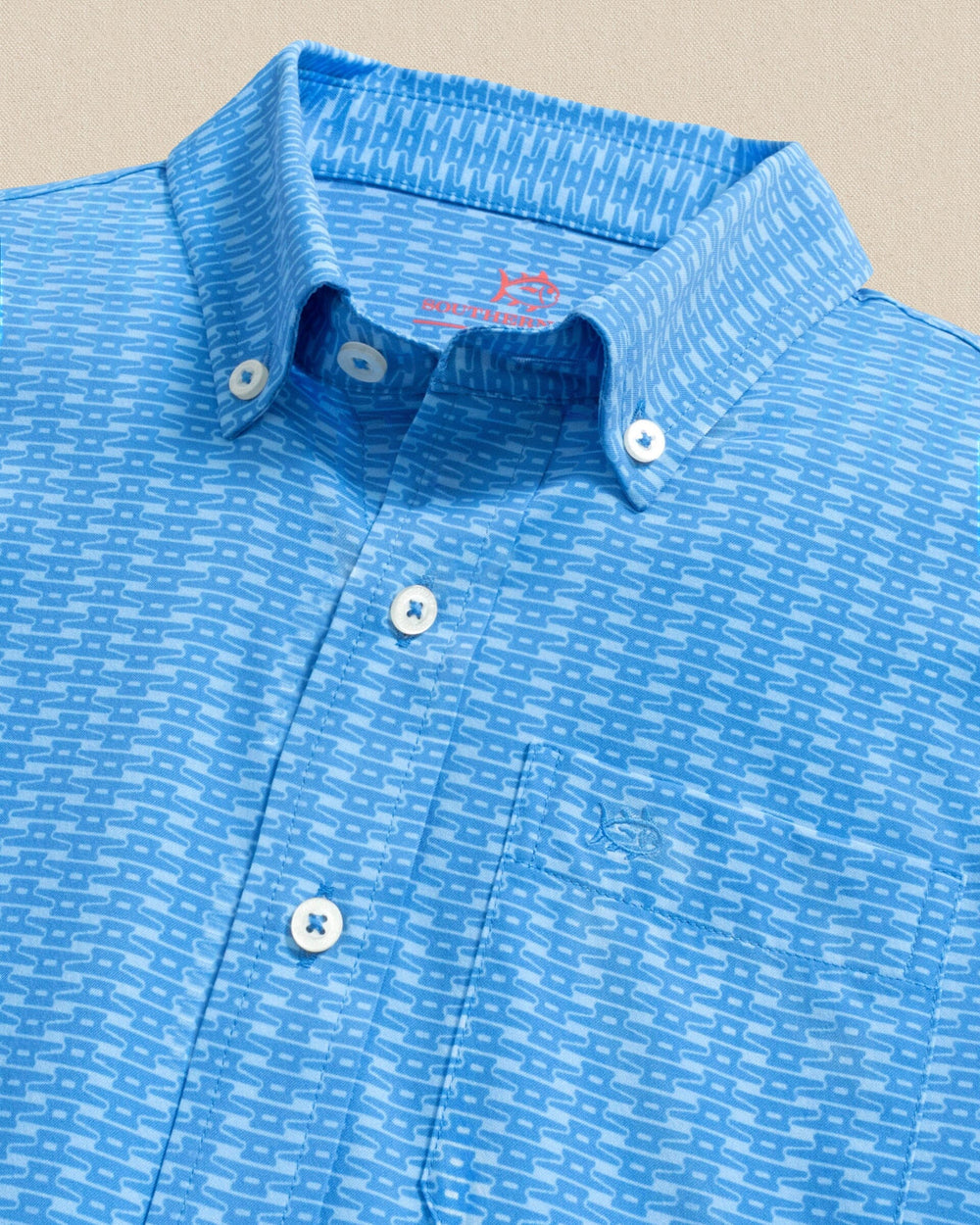 The detail view of the Southern Tide Boys Pop Lock & Dock It Coastal Breeze® Short Sleeve Sport Shirt by Southern Tide - Blue Stream