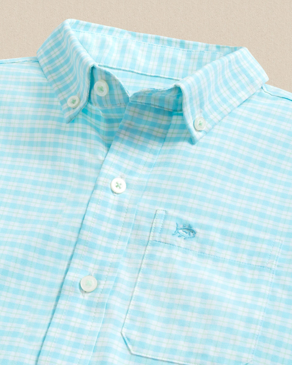 The detail view of the Southern Tide Boys Precheck Plaid Coastal Breeze® Sport Shirt by Southern Tide - Tropical Breeze Blue