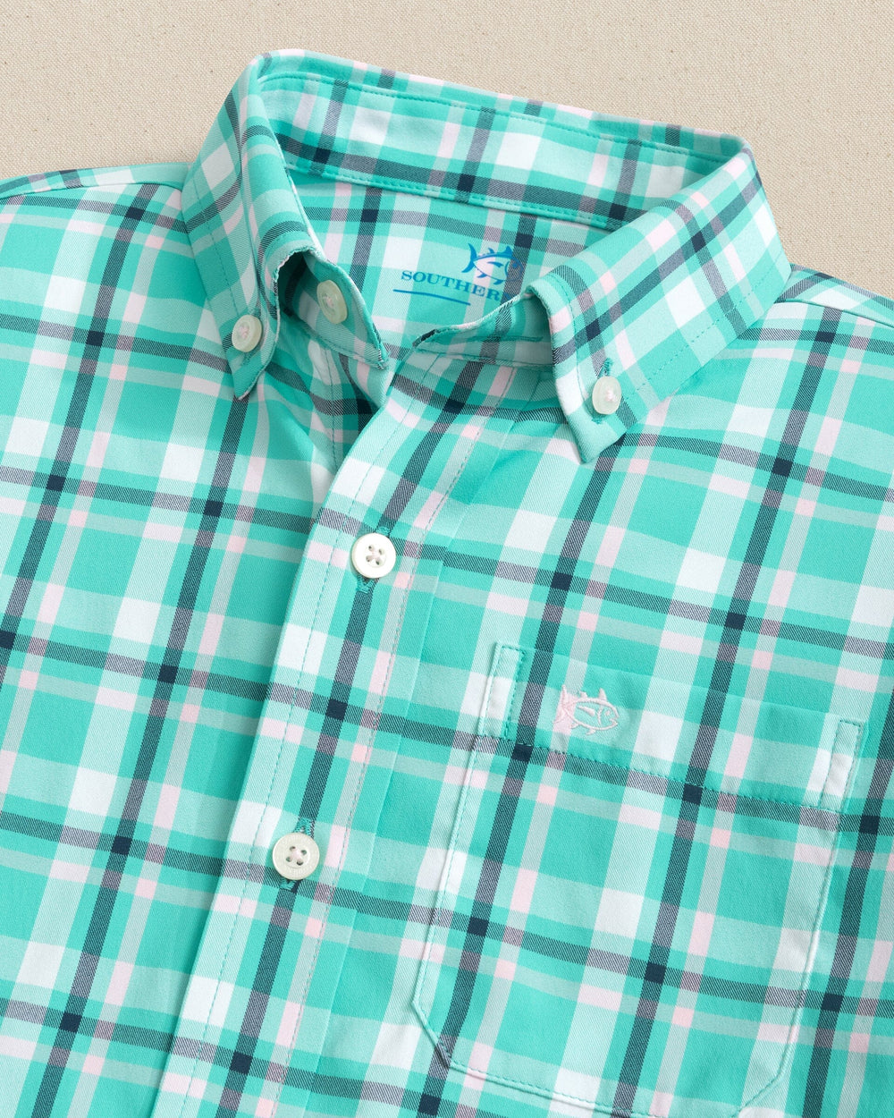 The collar view of the Southern Tide Boys River Ridge Plaid Intercoastal Long Sleeve Sport Shirt by Southern Tide - Turtle Green