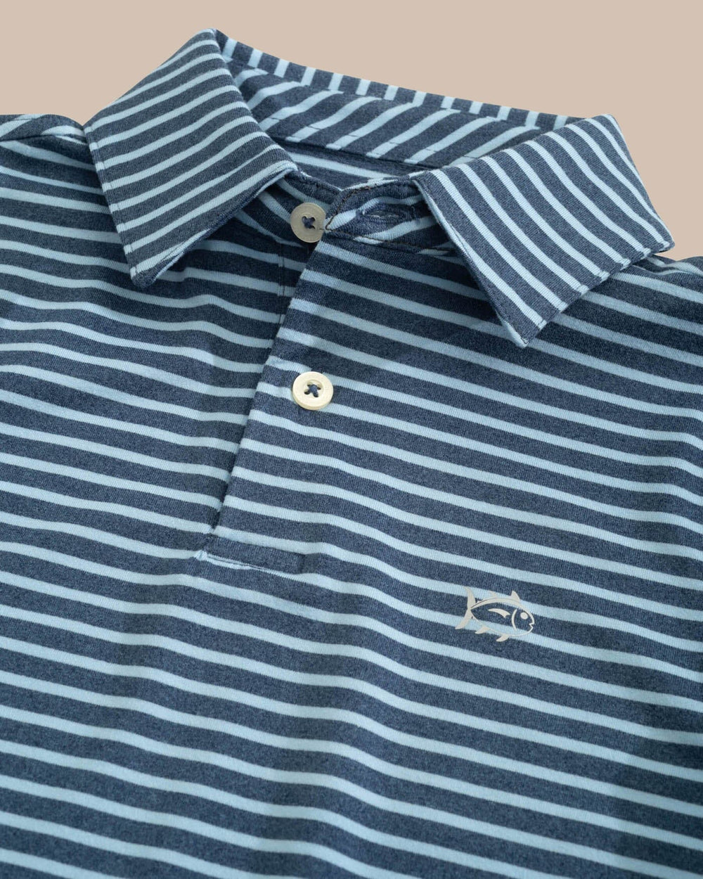 The detail view of the Southern Tide Boys Ryder Heather Marin Stripe Performance Polo Shirt by Southern Tide - Heather Aged Denim
