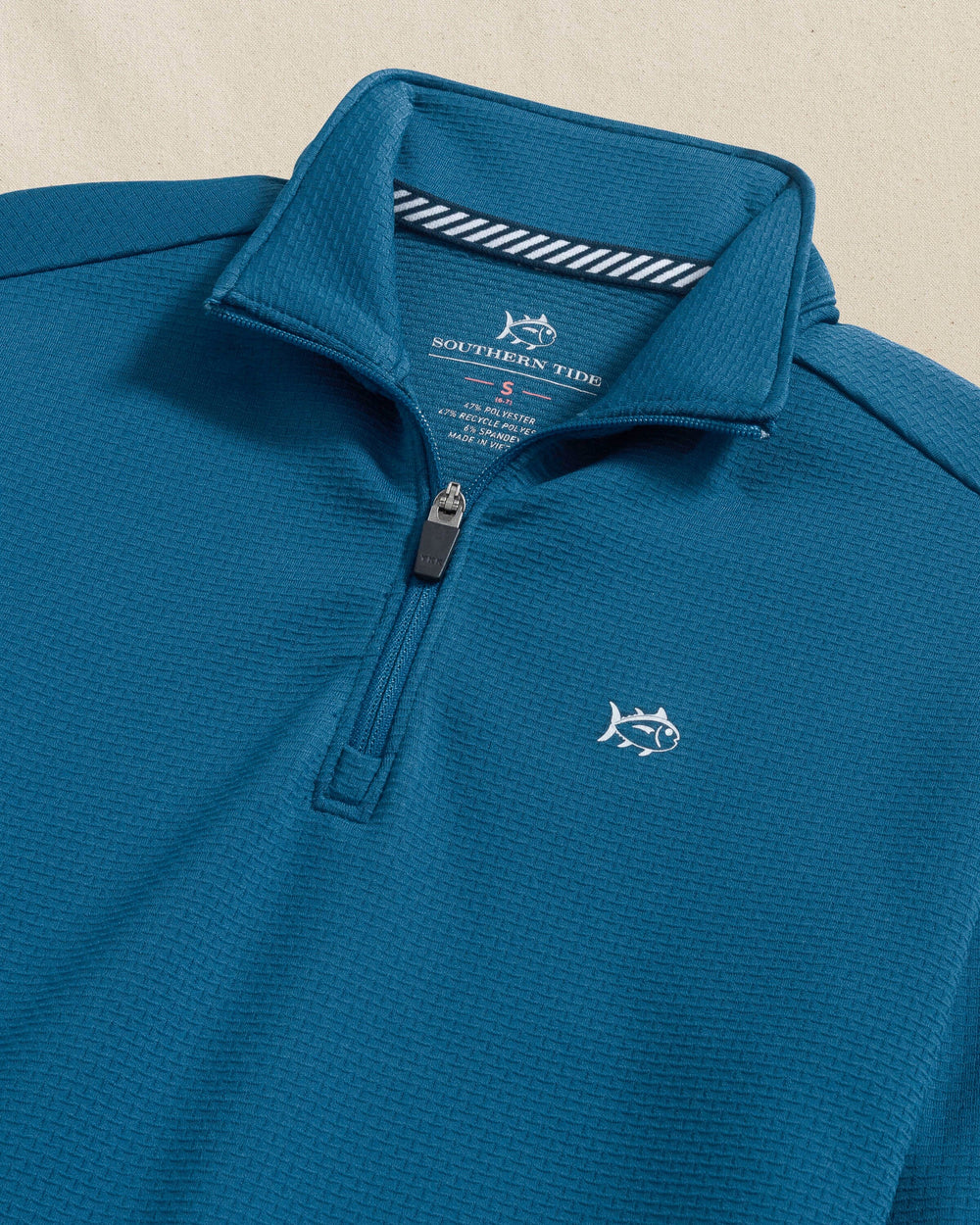 The detail view of the Southern Tide Boys Schooner Quarter Zip by Southern Tide - Nautical Blue