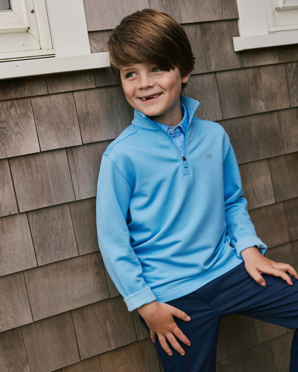 The lifestyle view of the Southern Tide Boys Schooner Quarter Zip by Southern Tide - Ocean Channel