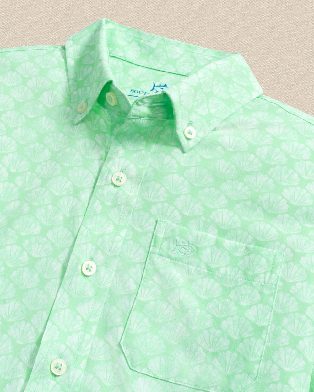 The detail view of the Southern Tide Boys Seashell Cove Coastal Breeze® Short Sleeve Sport Shirt by Southern Tide - Green Ash