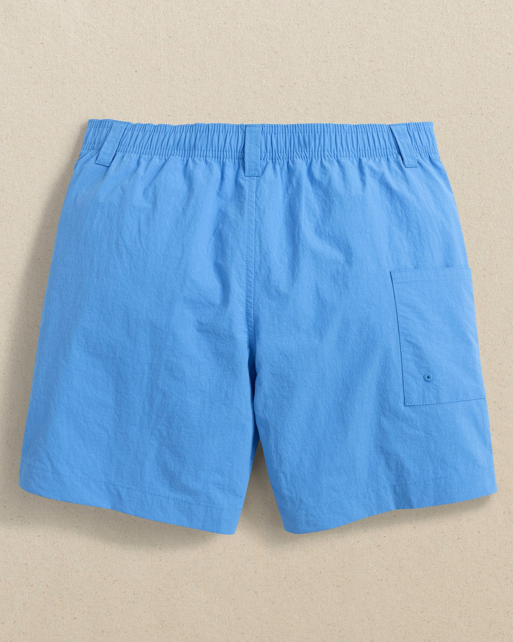 The back view of the Southern Tide Boys Shoreline Active Short by Southern Tide - Boat Blue