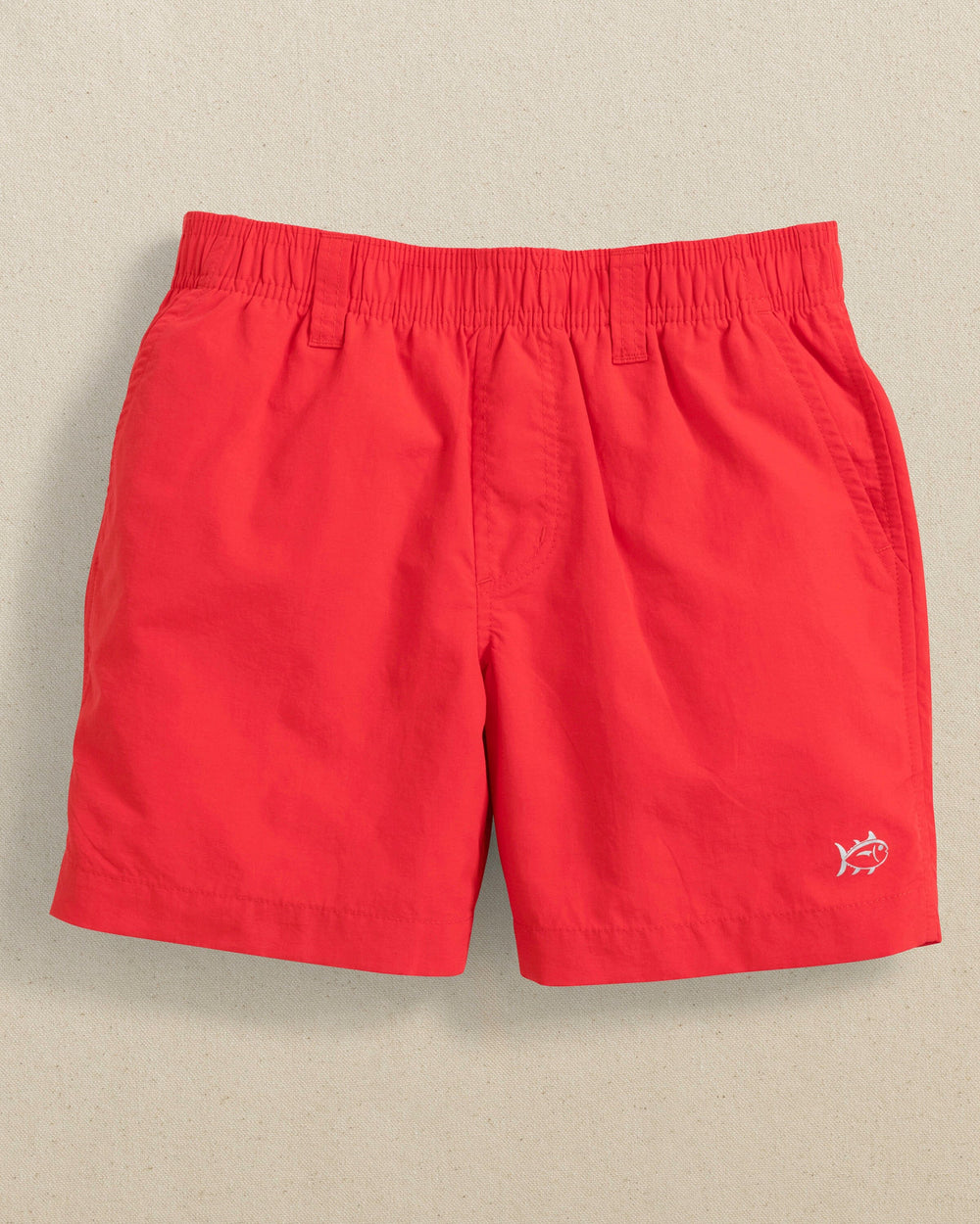 The front view of the Southern Tide Boys Shoreline Active Short by Southern Tide - Poppy Red