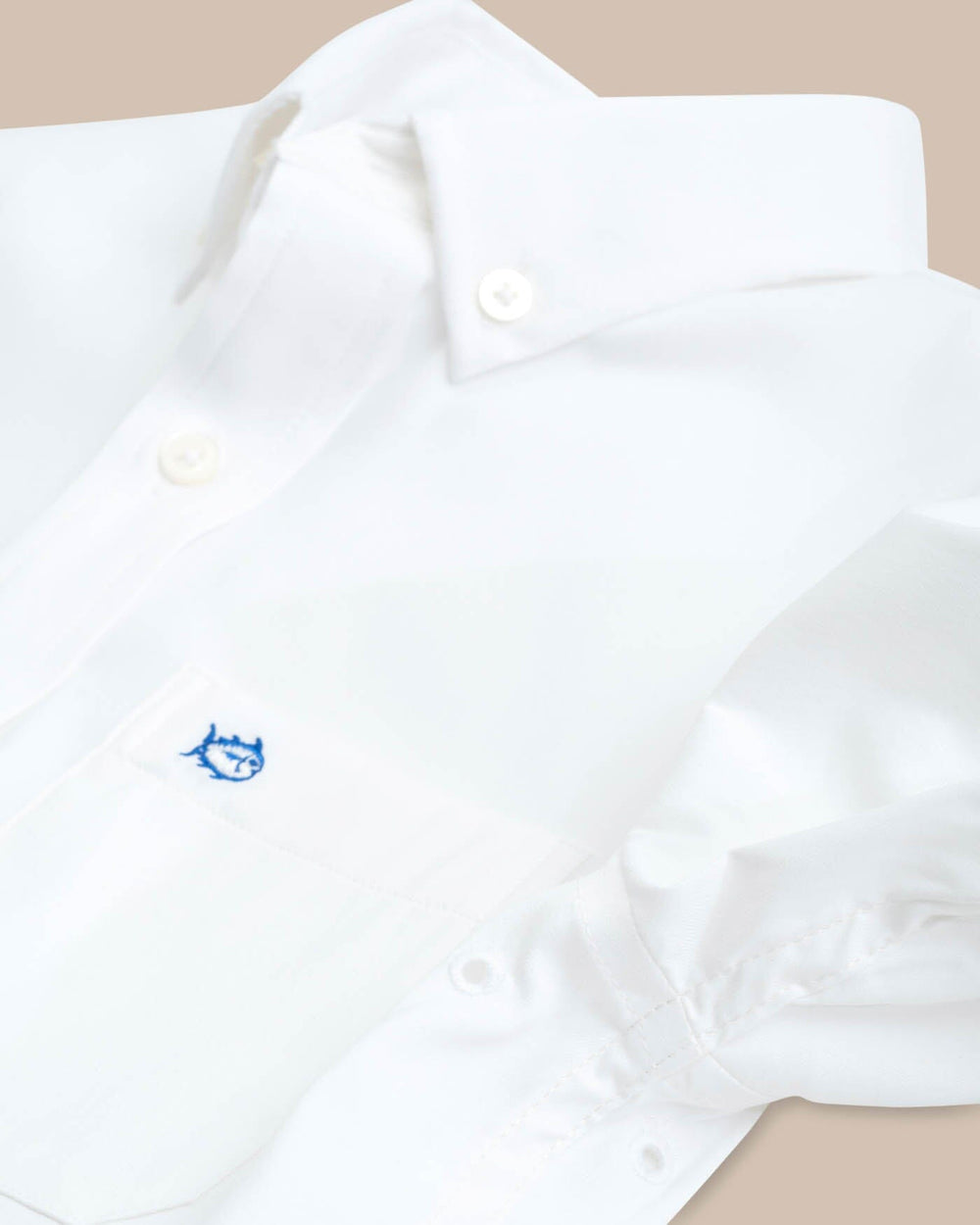 The eyelet of the Boys Solid Intercoastal Button Down Shirt by Southern Tide - Classic White