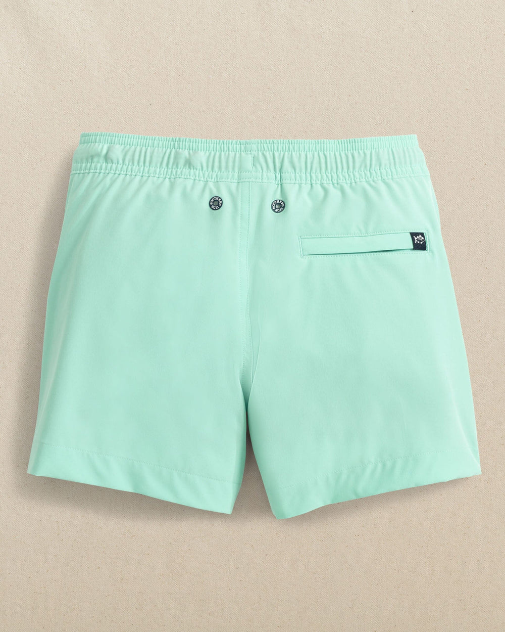 The back view of the Southern Tide Boys Solid Maritime Swim Trunk by Southern Tide - Garden Grove