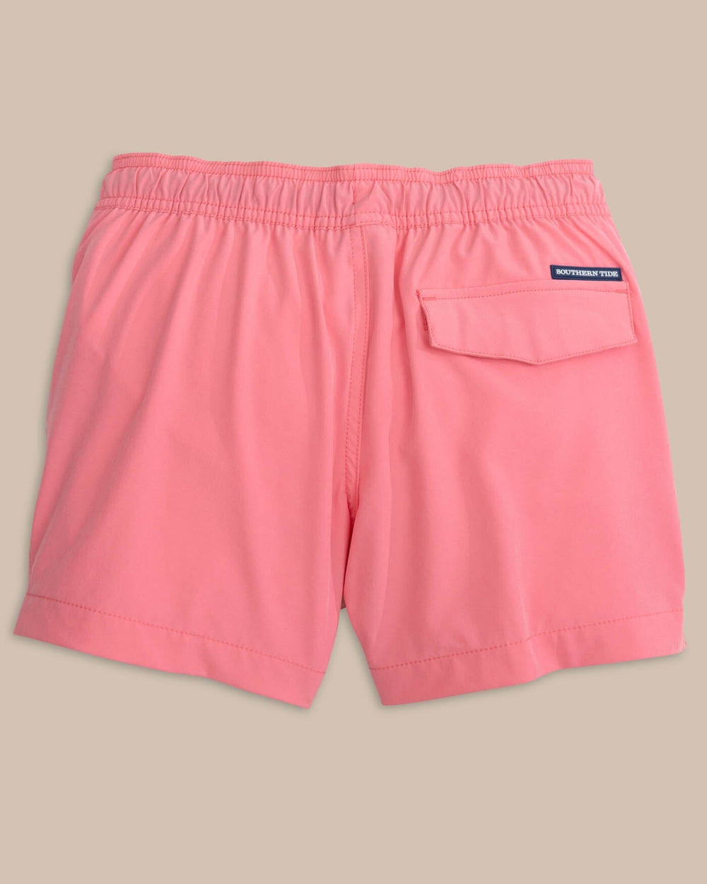The back view of the Southern Tide boys-solid-swim-trunk-2-1 by Southern Tide - Geranium Pink