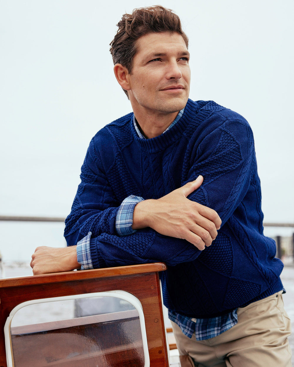 The lifestyle view of the Southern Tide Broad River Indigo Crewneck by Southern Tide - Dark Wash Indigo