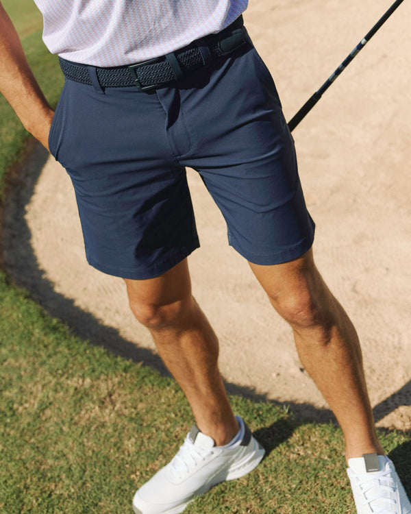 The lifestyle view of the Southern Tide brrr°®-die 8" Performance Short  in True Navy by Southern Tide - True Navy