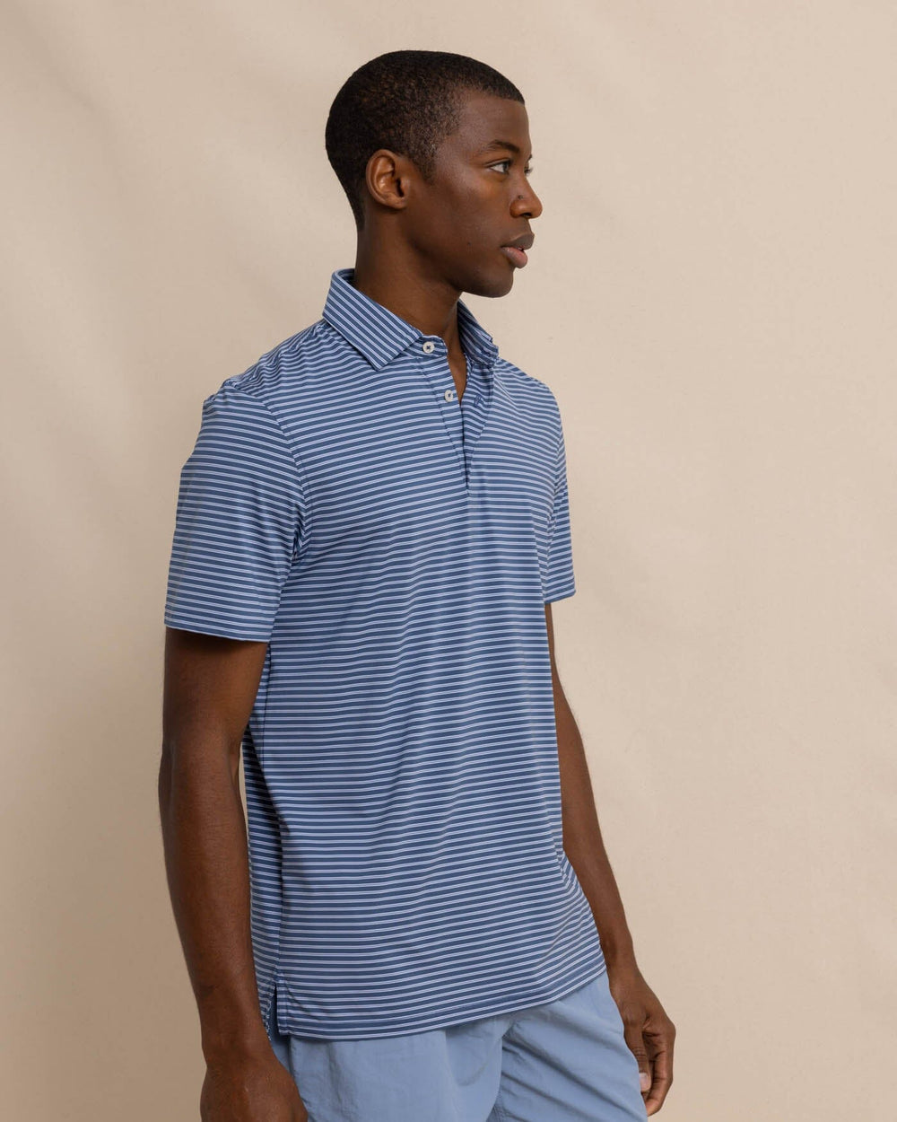 The front view of the Southern Tide brrr eeze Beattie Stripe Performance Polo by Southern Tide - Aged Denim