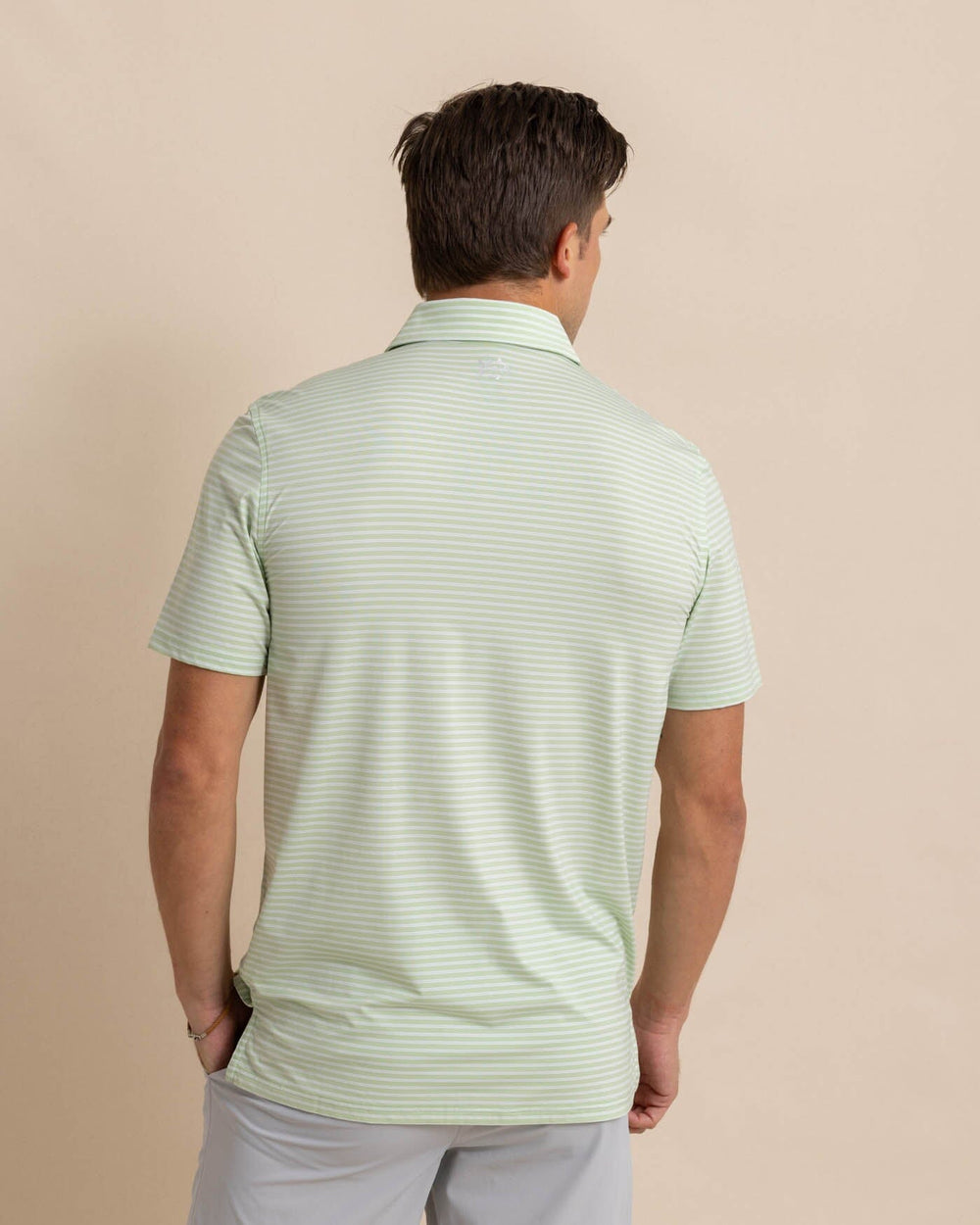 The back view of the Southern Tide brrr eeze Beattie Stripe Performance Polo by Southern Tide - Smoke Green