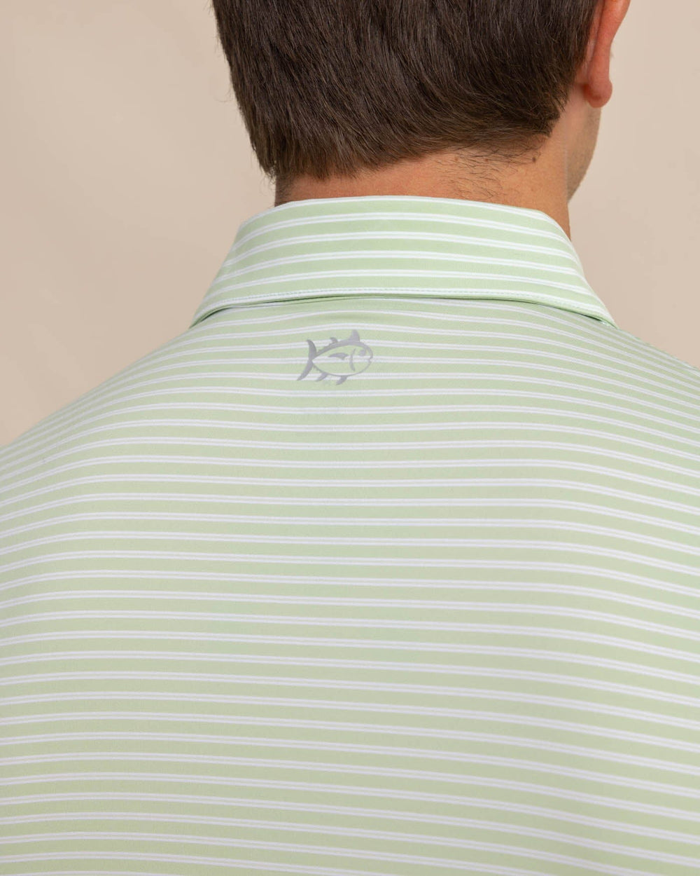 The detail view of the Southern Tide brrr eeze Beattie Stripe Performance Polo by Southern Tide - Smoke Green