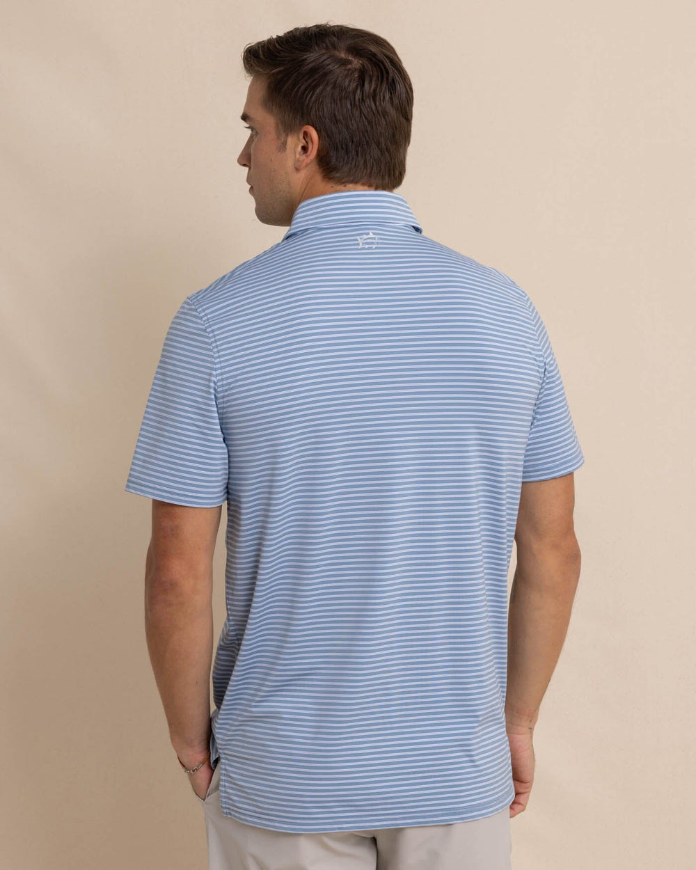 The back view of the Southern Tide brrr eeze Beattie Stripe Performance Polo by Southern Tide - Windward Blue