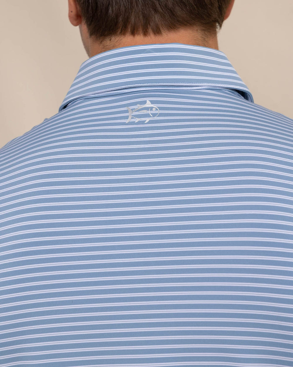 The detail view of the Southern Tide brrr eeze Beattie Stripe Performance Polo by Southern Tide - Windward Blue