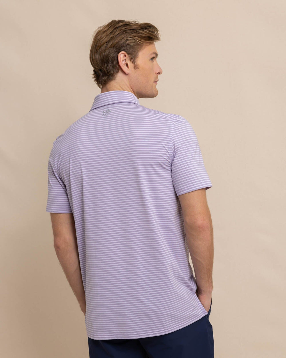 The back view of the Southern Tide brrr eeze Beattie Stripe Performance Polo by Southern Tide - Wisteria Purple