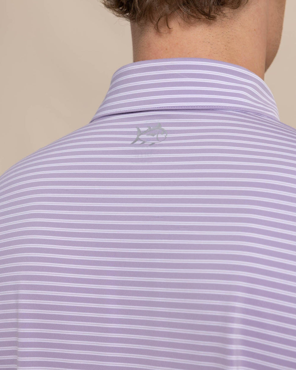 The detail view of the Southern Tide brrr eeze Beattie Stripe Performance Polo by Southern Tide - Wisteria Purple