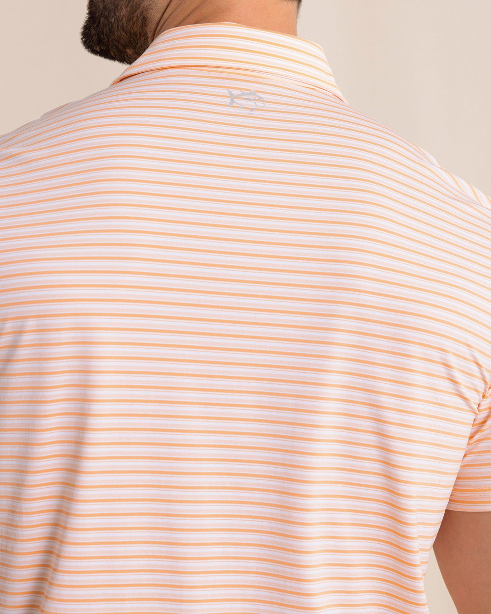 The back detail view of the Southern Tide brrr°®-eeze Breezy Point Stripe Polo by Southern Tide - Cantaloupe