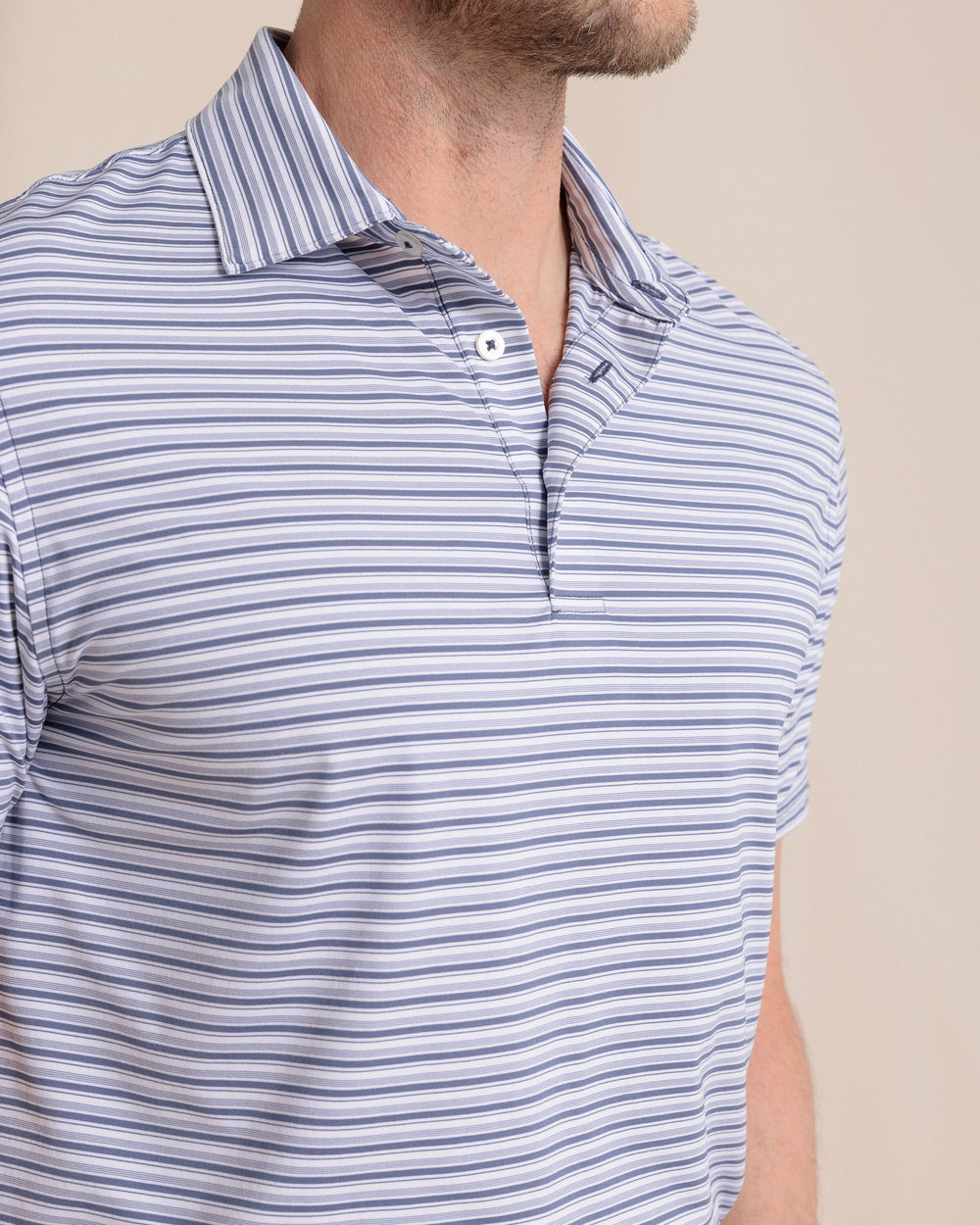 The front detail view of the Southern Tide brrr°®-eeze Breezy Point Stripe Polo by Southern Tide - Light Indigo