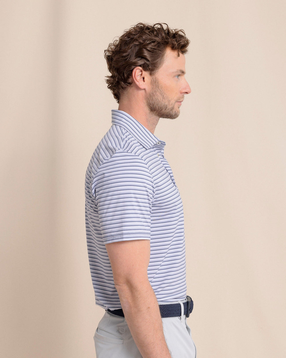 The side view of the Southern Tide brrr°®-eeze Breezy Point Stripe Polo by Southern Tide - Light Indigo