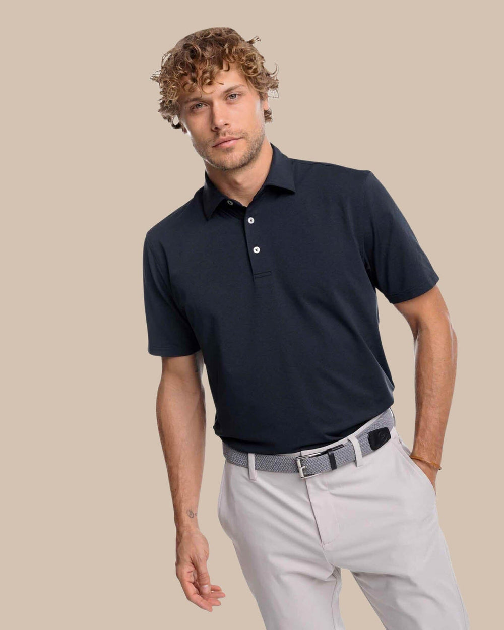 The front view of the Southern Tide brrr-eeze Heather Performance Polo Shirt by Southern Tide - Heather Caviar Black