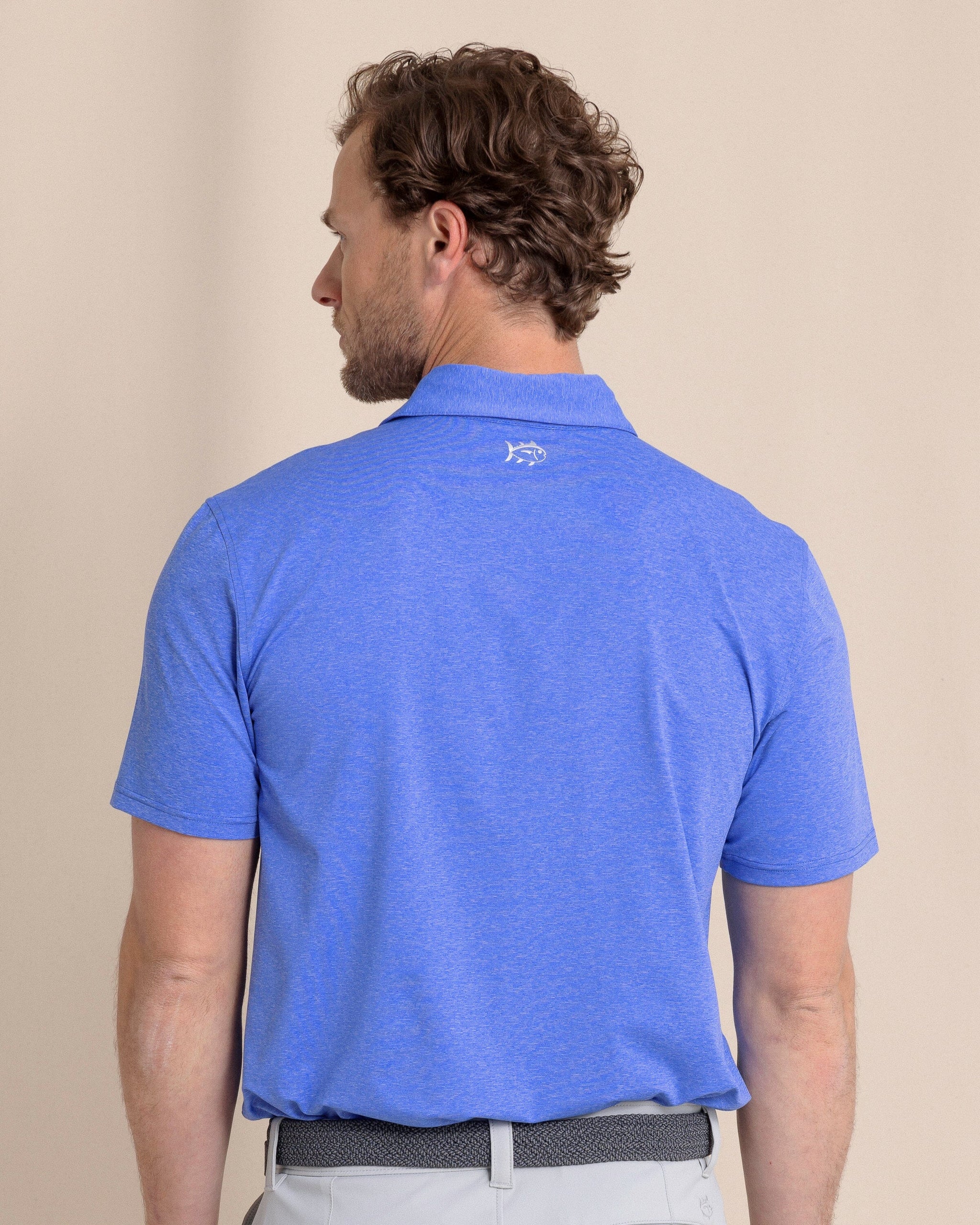 The back view of the Southern Tide brrr°®-eeze Heather Performance Polo Shirt by Southern Tide - Heather Dazzling Blue