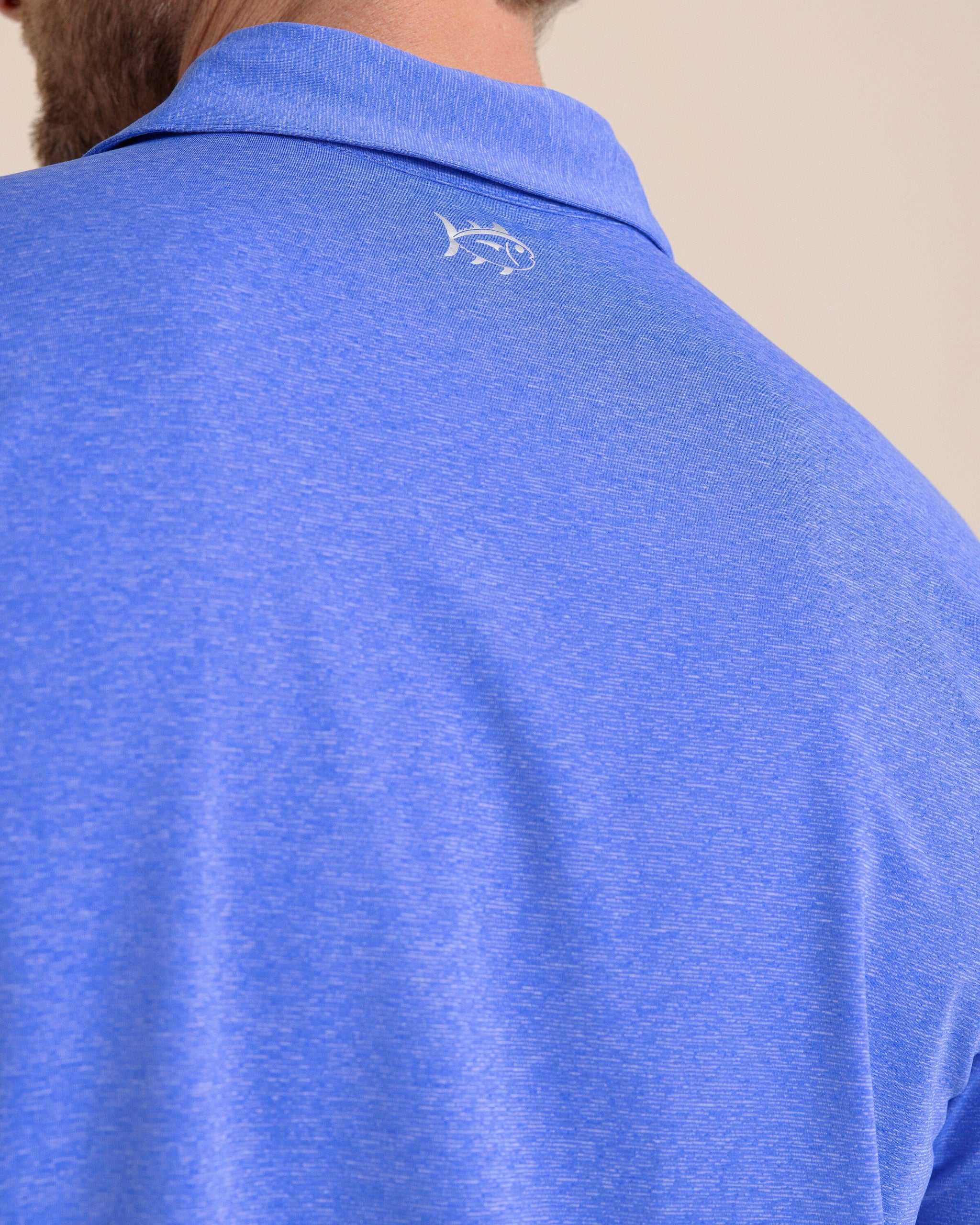 The back detail view of the Southern Tide brrr°®-eeze Heather Performance Polo Shirt by Southern Tide - Heather Dazzling Blue