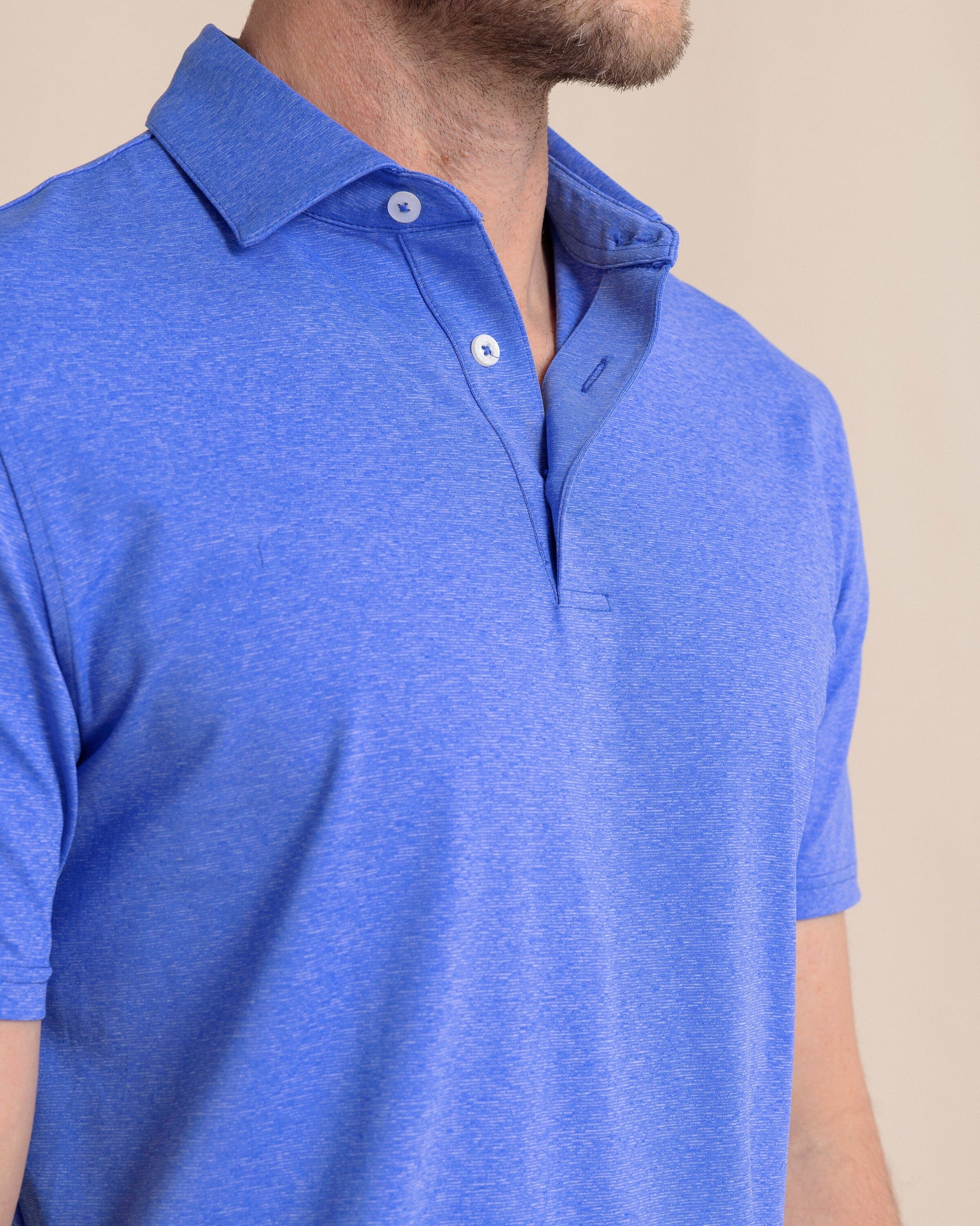 The front detail view of the Southern Tide brrr°®-eeze Heather Performance Polo Shirt by Southern Tide - Heather Dazzling Blue