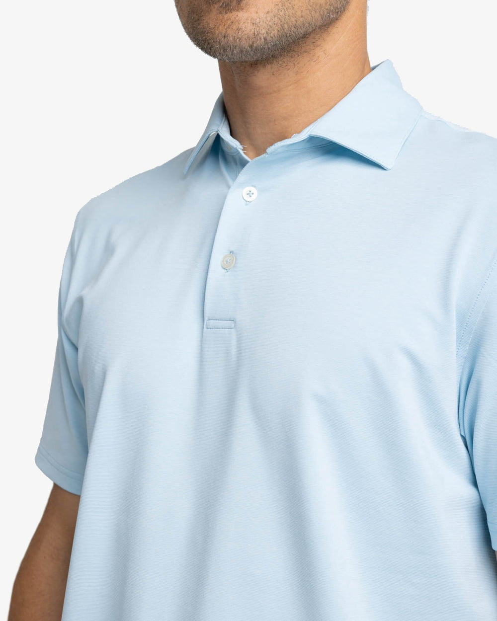 The detail view of the Southern Tide brrr-eeze Heather Performance Polo Shirt by Southern Tide - Heather Dream Blue