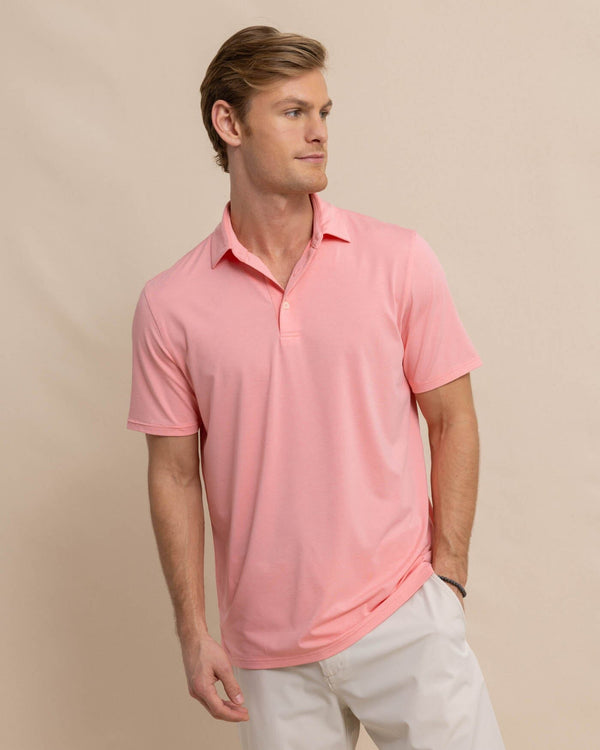 The front view of the Southern Tide brrr-eeze-heather-performance-polo-shirt by Southern Tide - Heather Flamingo Pink