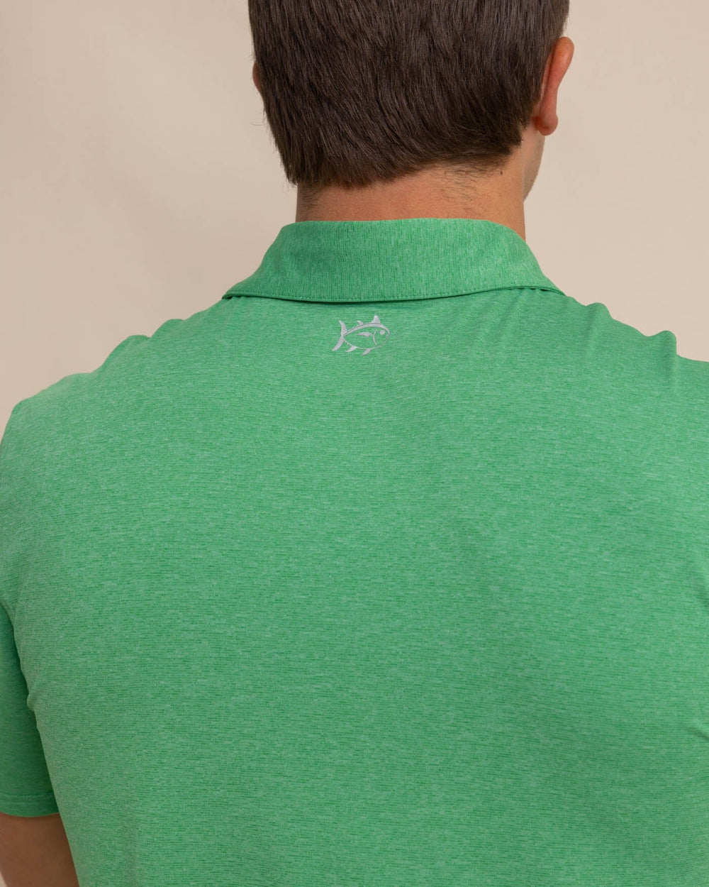 The detail view of the Southern Tide brrr-eeze-heather-performance-polo-shirt by Southern Tide - Heather Kelly Green