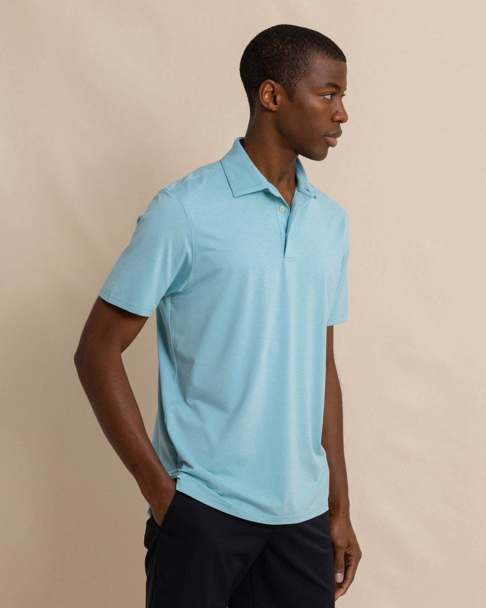 The front view of the Southern Tide brrr eeze Heather Performance Polo Shirt by Southern Tide - Heather Marine Blue