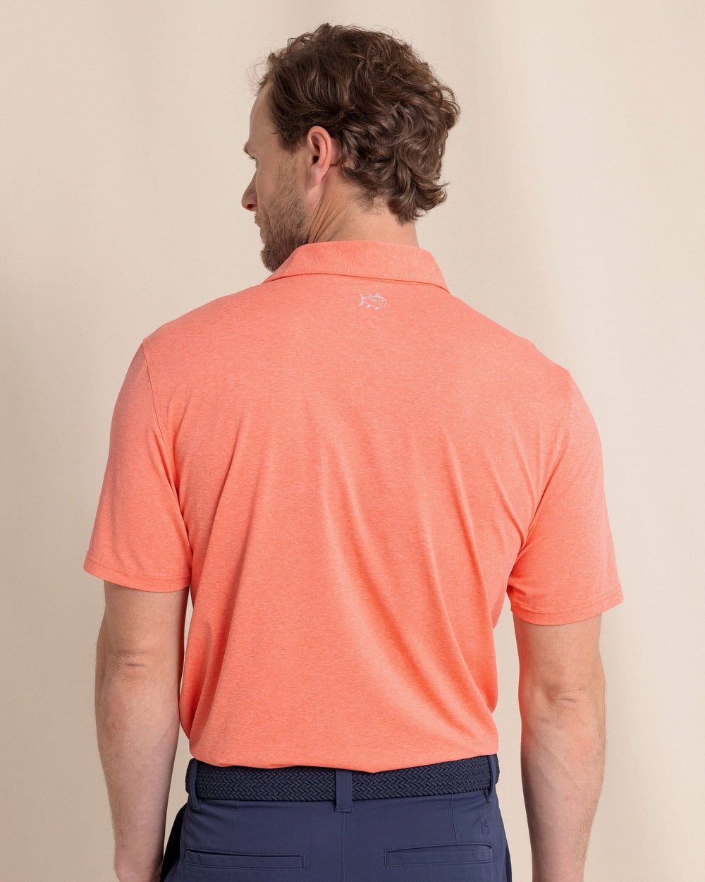 The back view of the Southern Tide brrr°®-eeze Heather Performance Polo Shirt by Southern Tide - Heather Melon