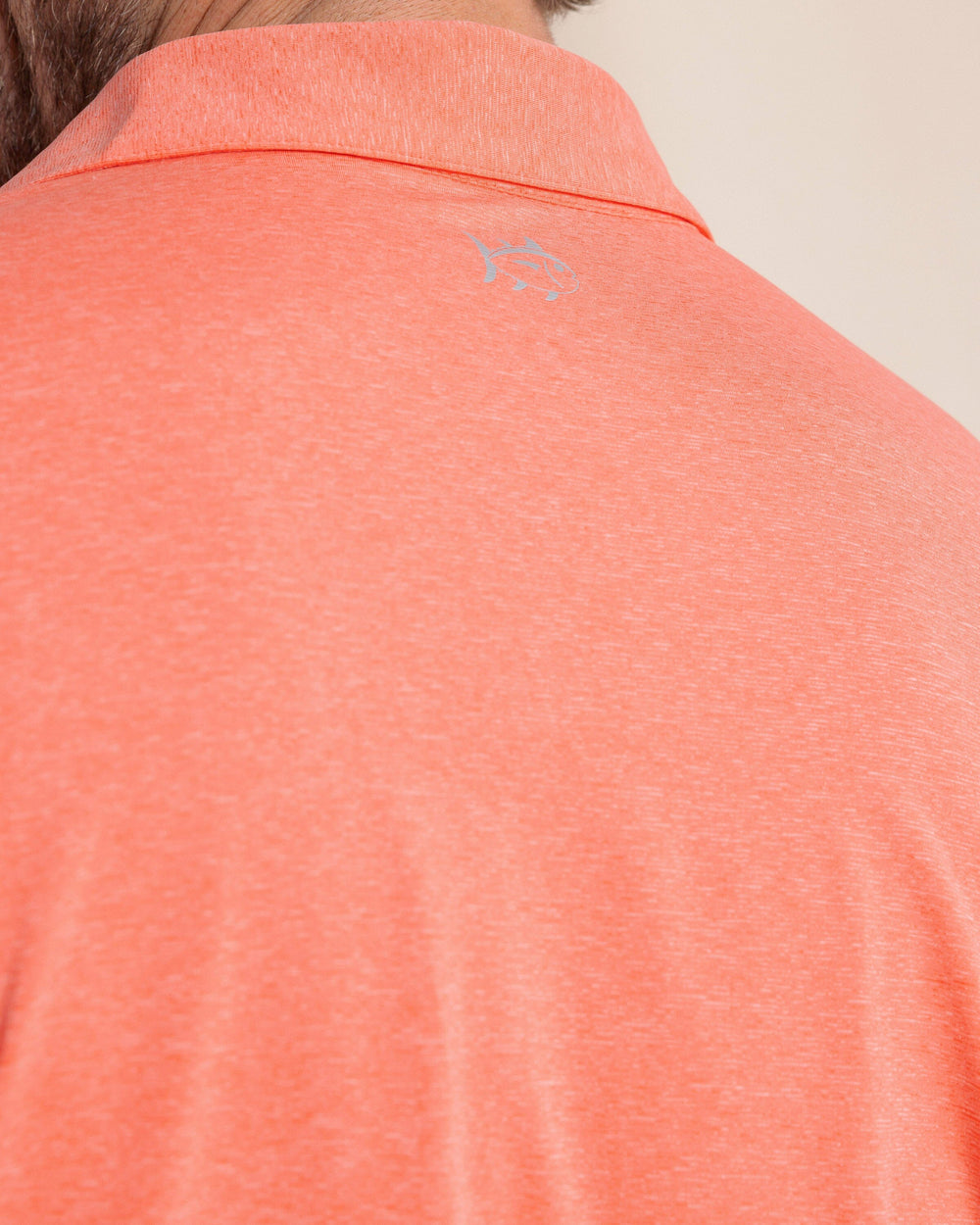 The back detail view of the Southern Tide brrr°®-eeze Heather Performance Polo Shirt by Southern Tide - Heather Melon