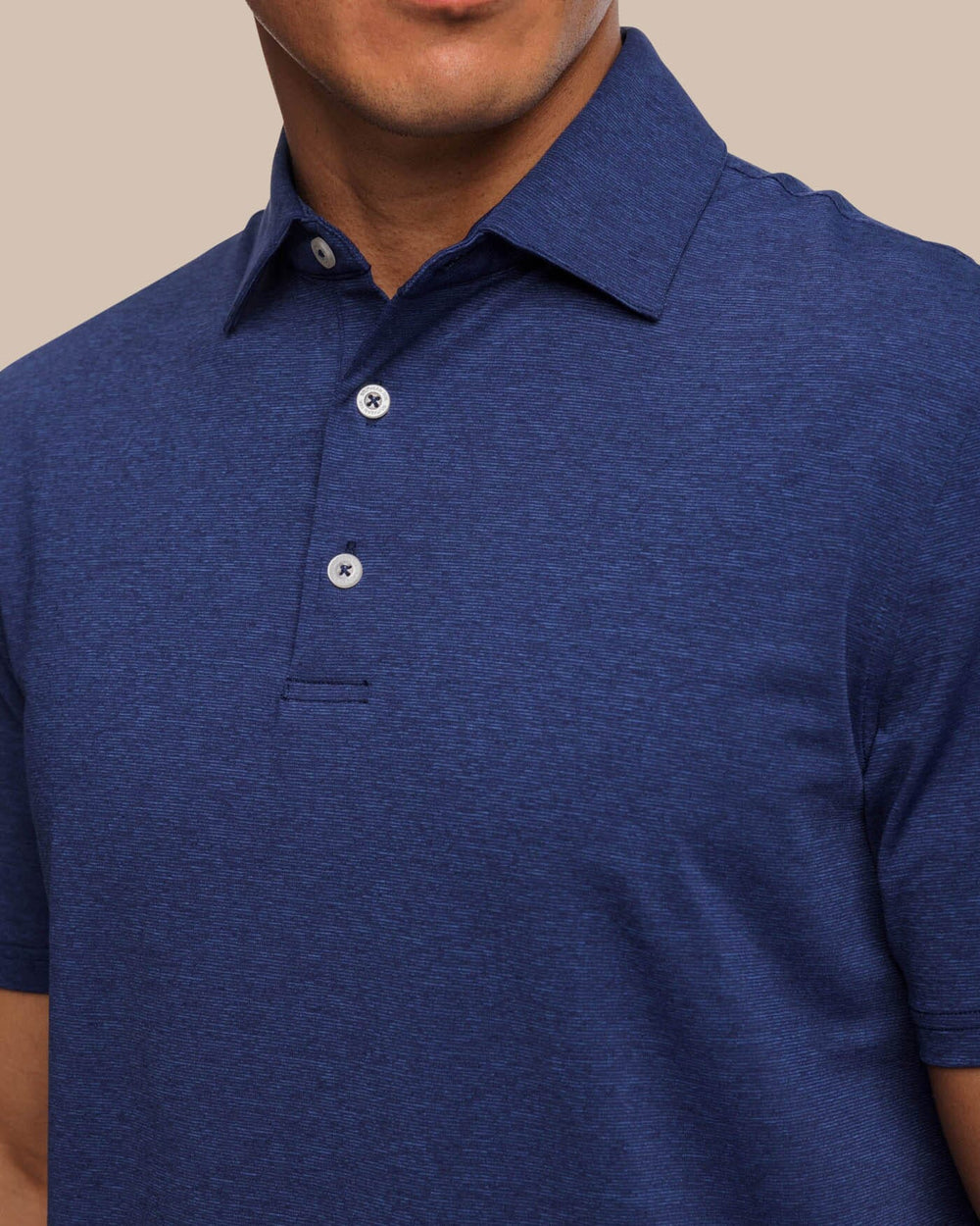 The detail view of the brrr°®-eeze Heather Performance Polo Shirt by Southern Tide - Heather Nautical Navy