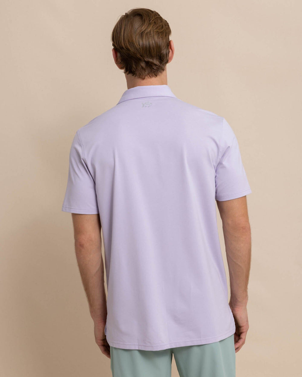 The back view of the Southern Tide brrr eeze Heather Performance Polo Shirt by Southern Tide - Heather Orchid Petal