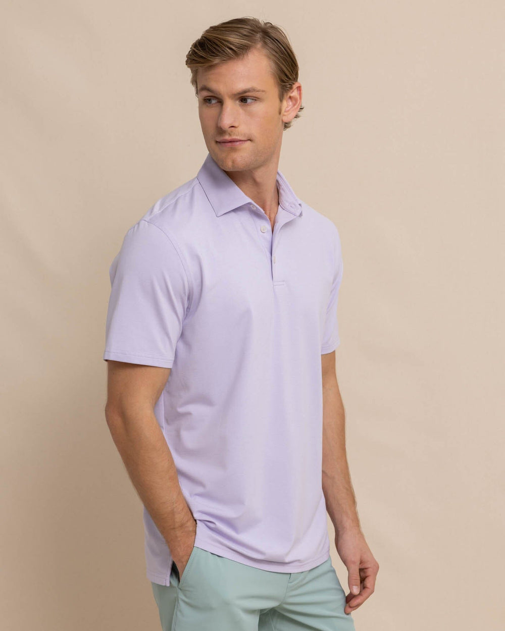 The front view of the Southern Tide brrr eeze Heather Performance Polo Shirt by Southern Tide - Heather Orchid Petal
