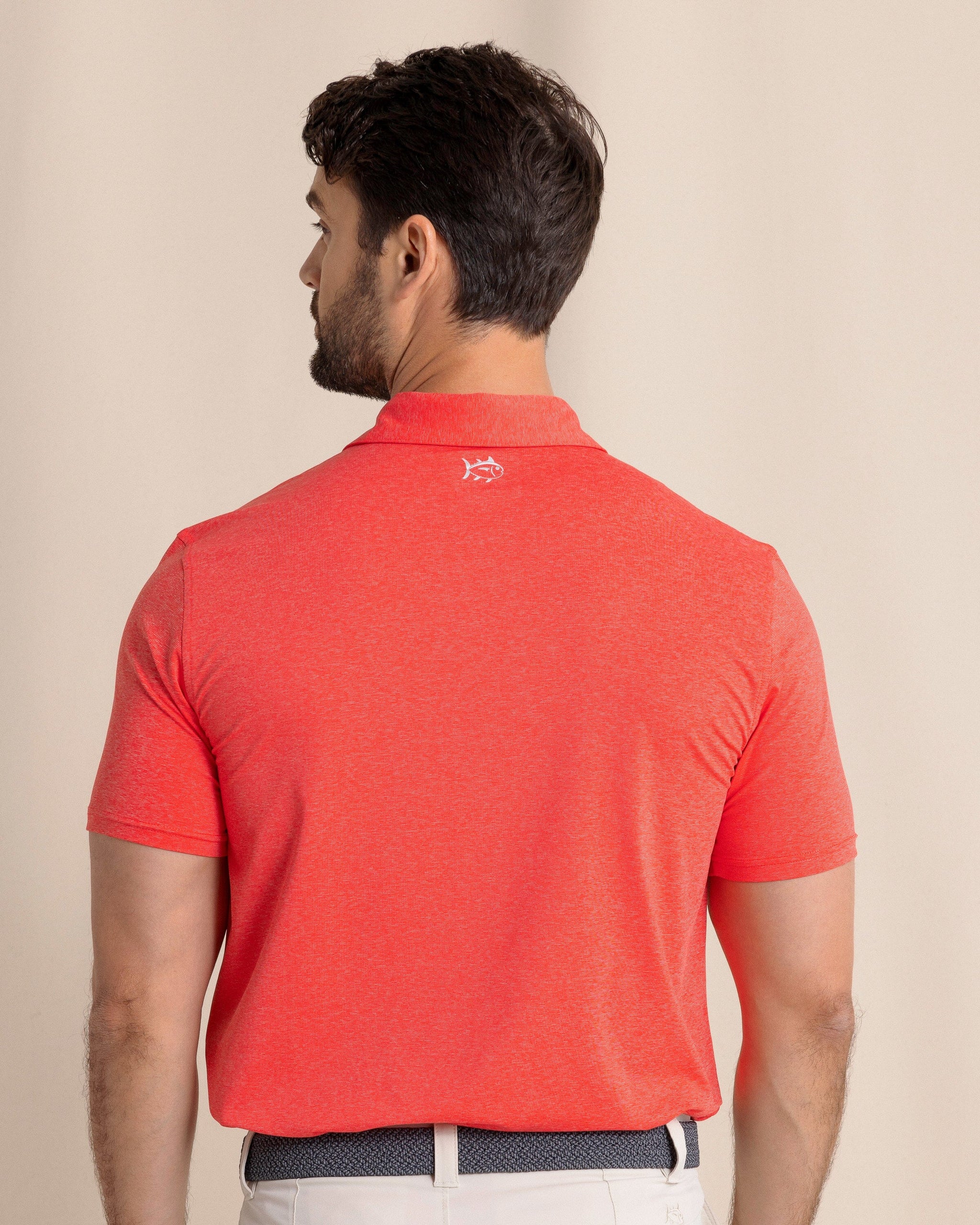 The back view of the Southern Tide brrr°®-eeze Heather Performance Polo Shirt by Southern Tide - Heather  Poppy Red