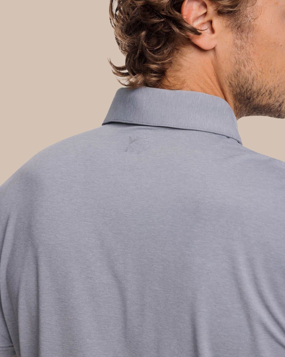 The yoke view of the brrr°®-eeze Heather Performance Polo Shirt by Southern Tide - Heather Steel Grey