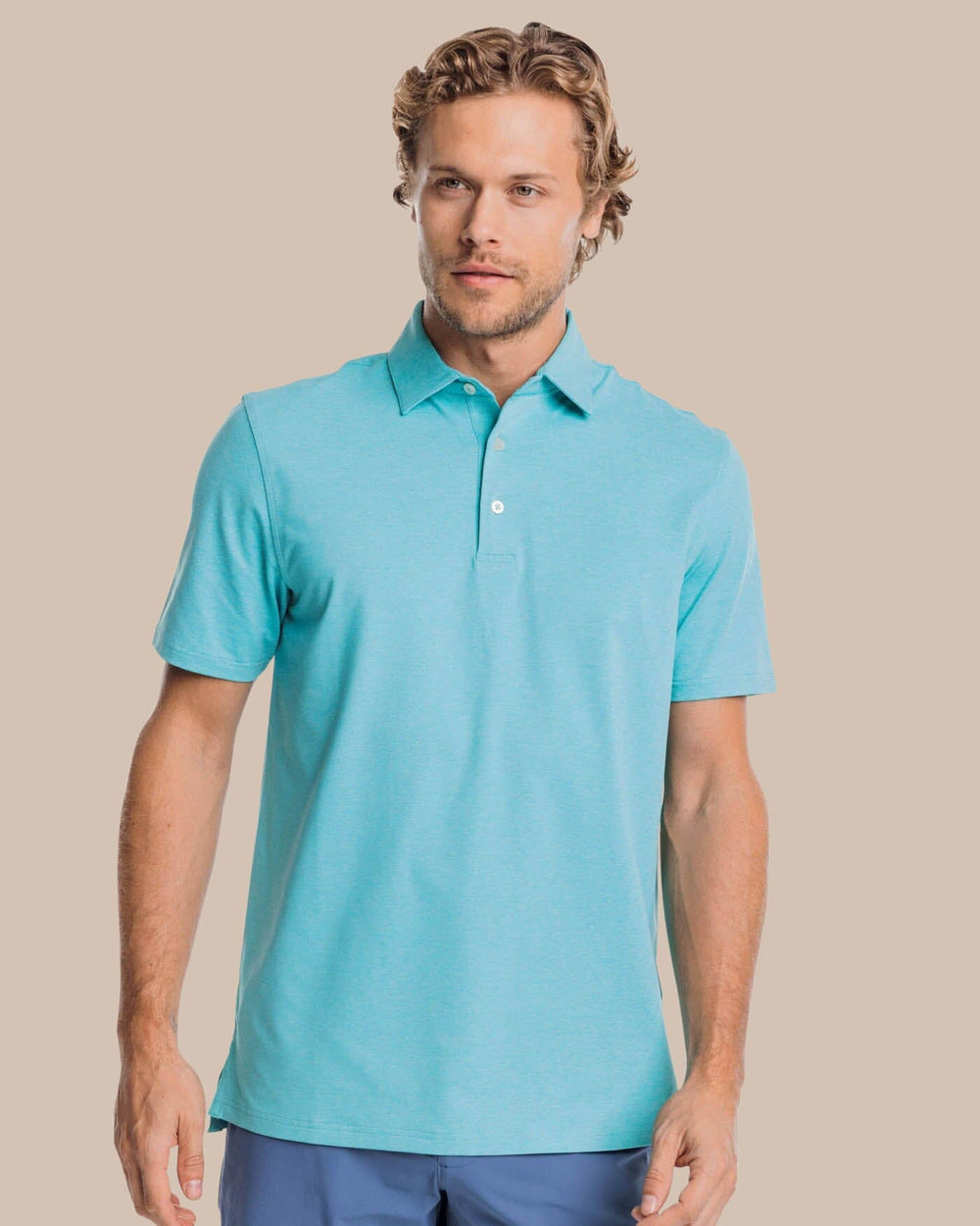 The front view of the brrr°®-eeze Heather Performance Polo Shirt by Southern Tide - Heather Tidal Wave