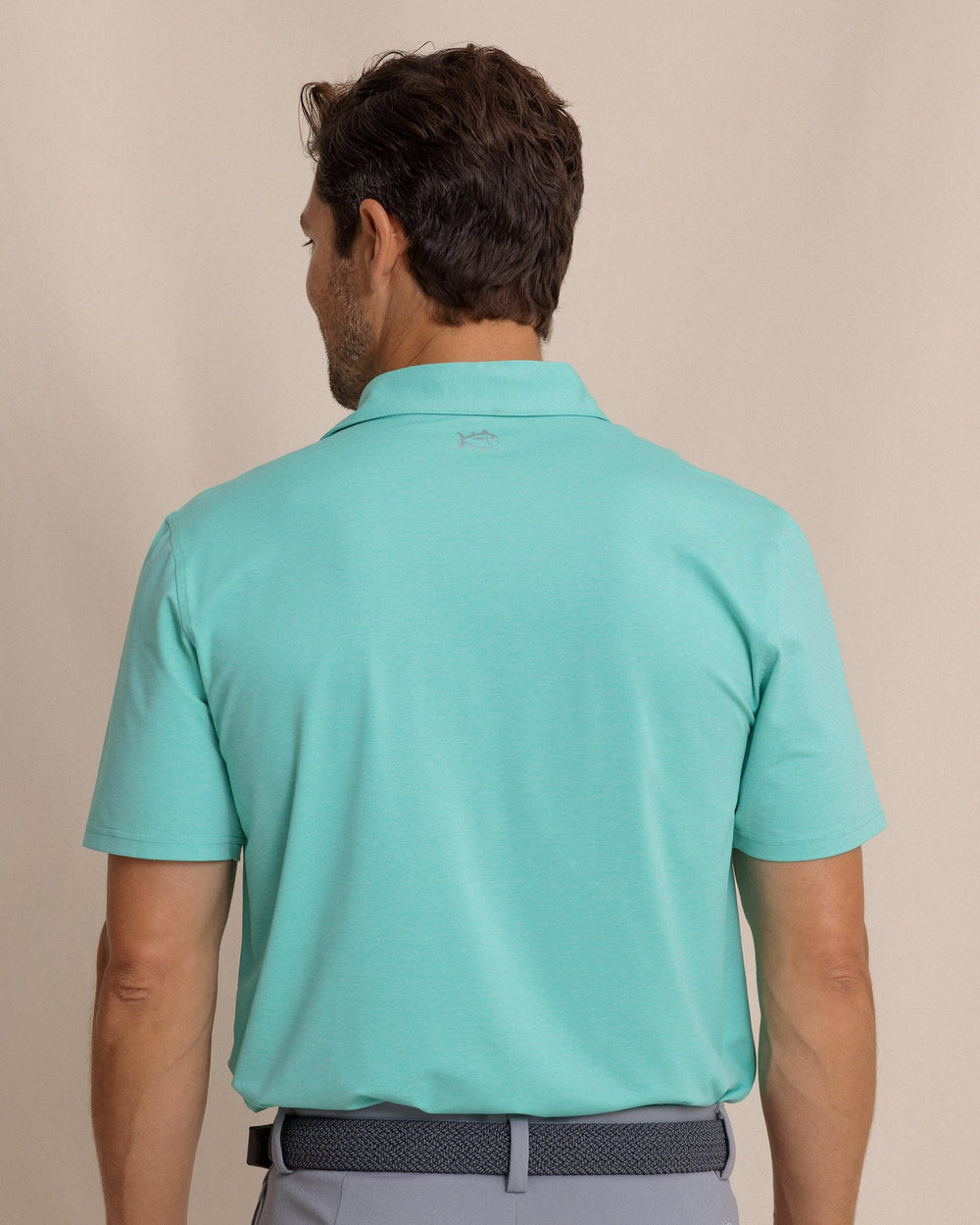 The back view of the Southern Tide brrr°®-eeze Heather Performance Polo Shirt by Southern Tide - Heather Turtle Green