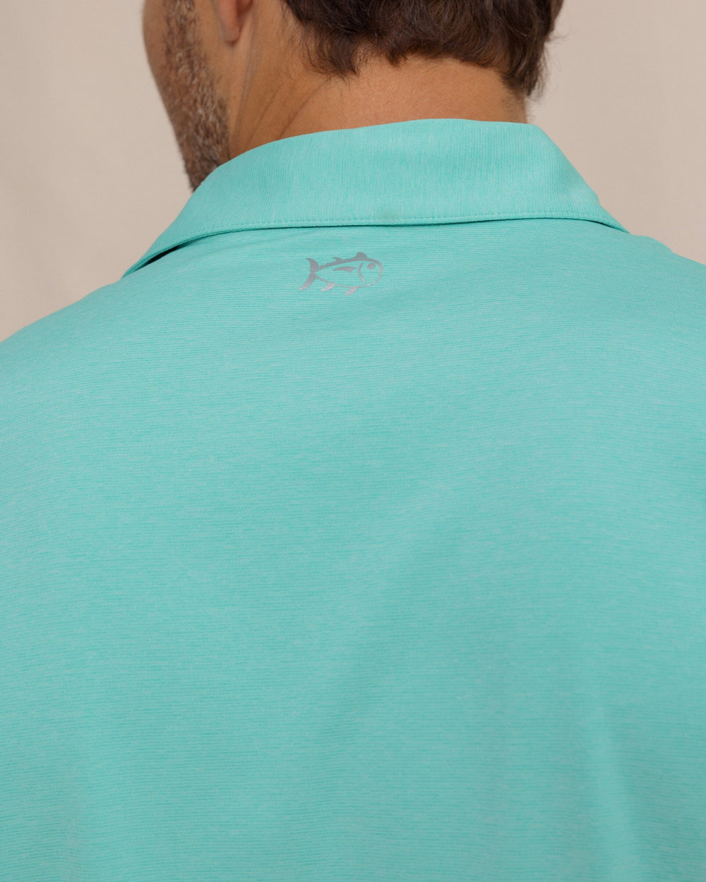 The detail view of the Southern Tide brrr°®-eeze Heather Performance Polo Shirt by Southern Tide - Heather Turtle Green