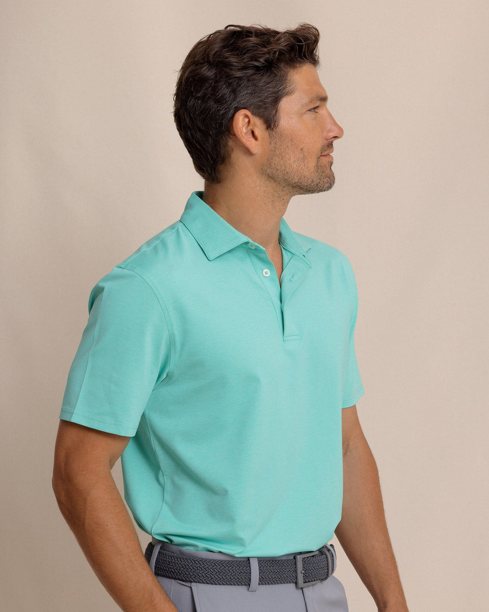 The front view of the Southern Tide brrr°®-eeze Heather Performance Polo Shirt by Southern Tide - Heather Turtle Green