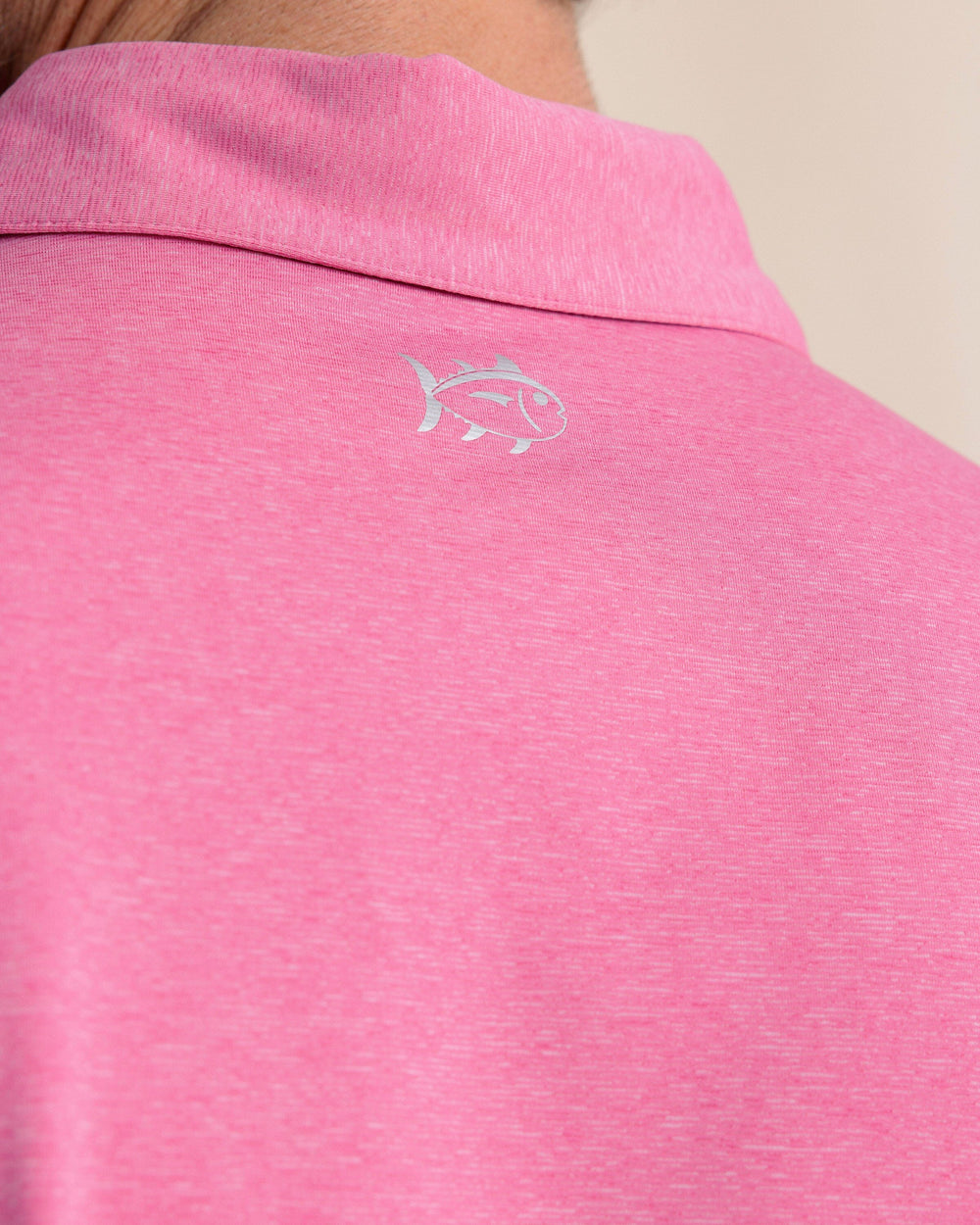 The back detail view of the Southern Tide brrr°®-eeze Heather Performance Polo Shirt by Southern Tide - Heather Very Berry