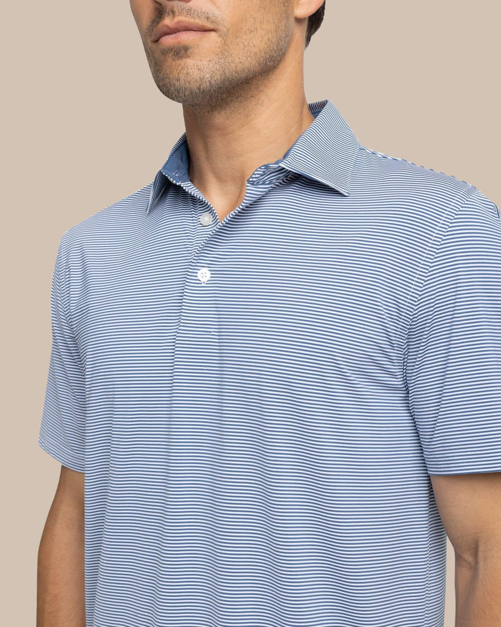 The detail view of the Southern Tide brrr-eeze Meadowbrook Stripe Polo by Southern Tide - Aged Denim