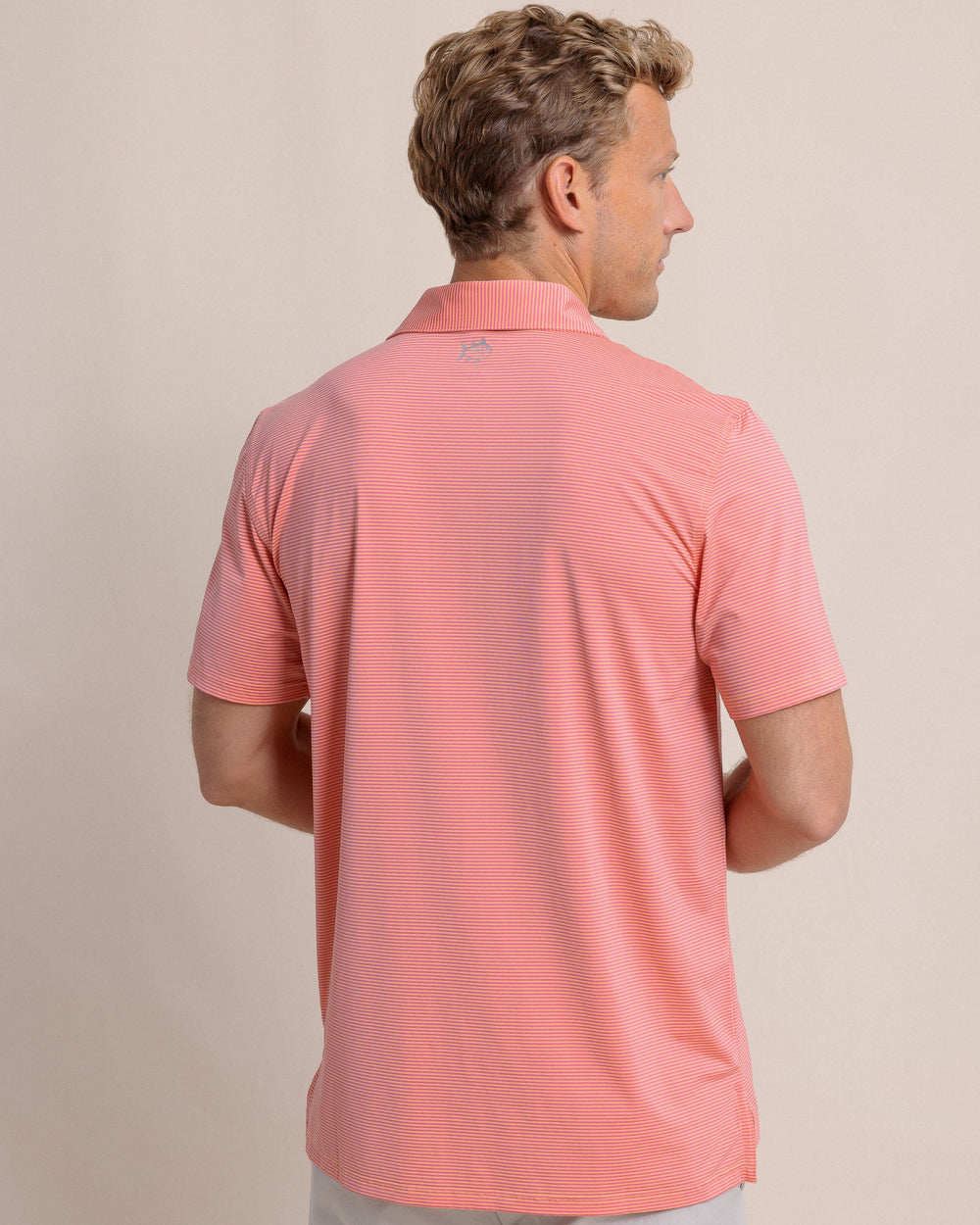 The back view of the Southern Tide brrr-eeze Meadowbrook Stripe Polo by Southern Tide - Cantaloupe